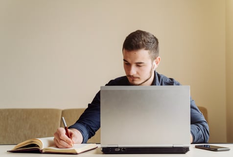 young-businessman-working-with-computer-remotely
